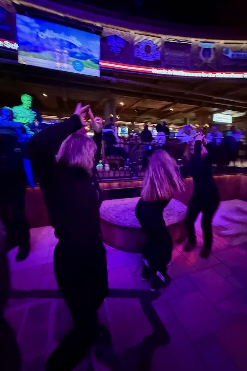 3 women dancing at the Hohenhaus Tenne aprés bar in Schladming Austria