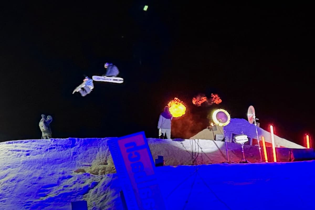 Rapid fire snowboard jumps, music and flame thrower at Freestyle Show, Saalbach, Austria