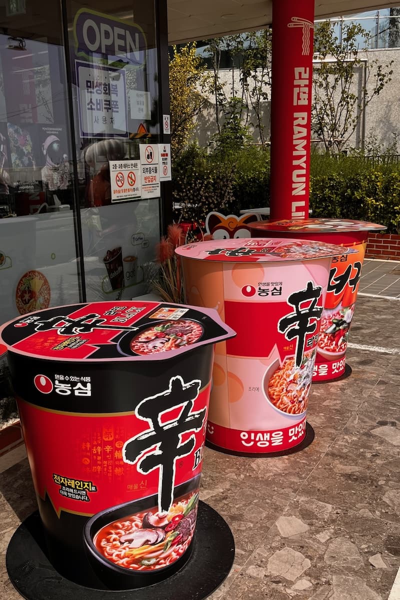 Giant noodle pot tables outside a convenience store in Busan Korea