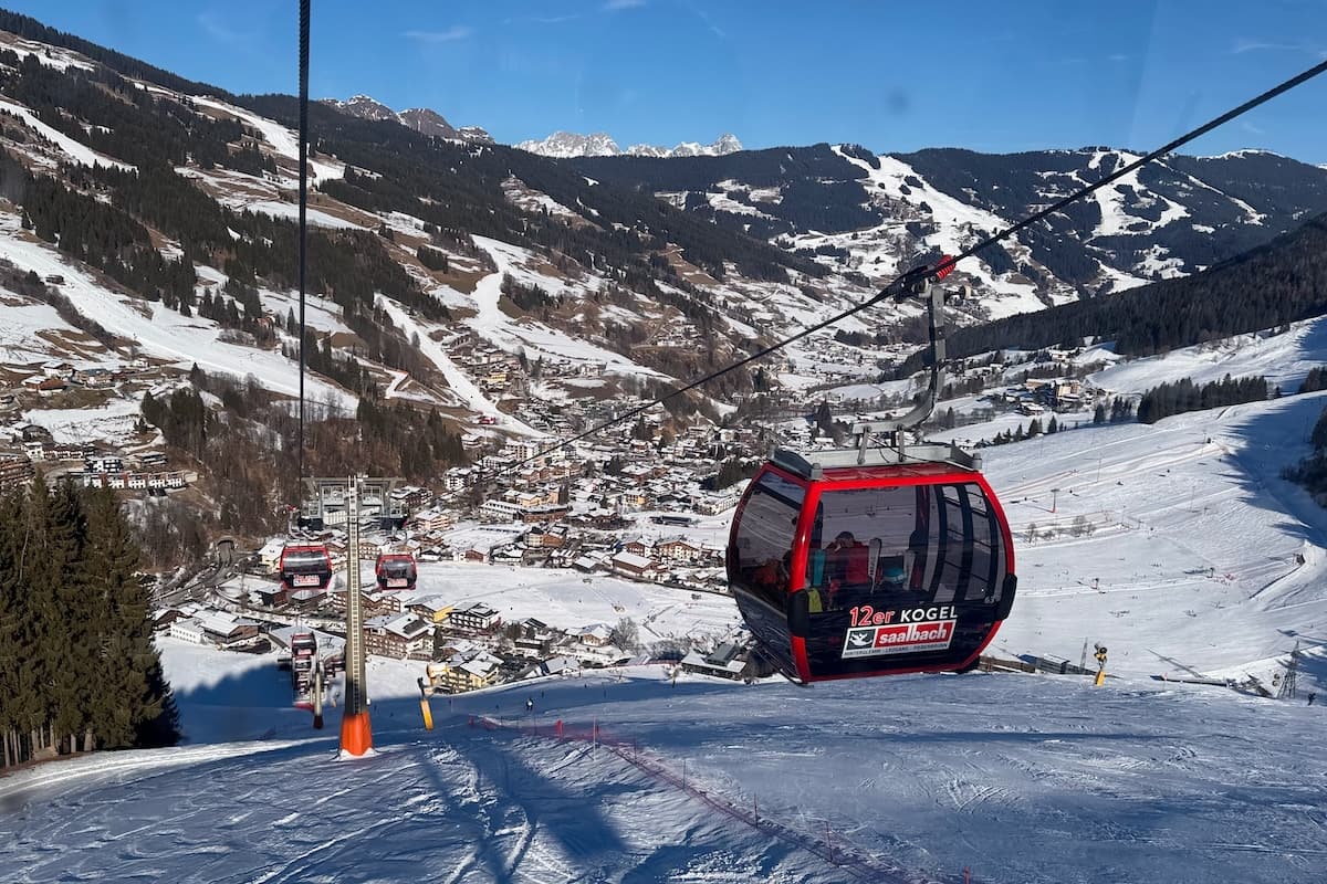 12er Kogel lift descending into snowy Saalbach-Hinterglemm, Austria on a sunny day