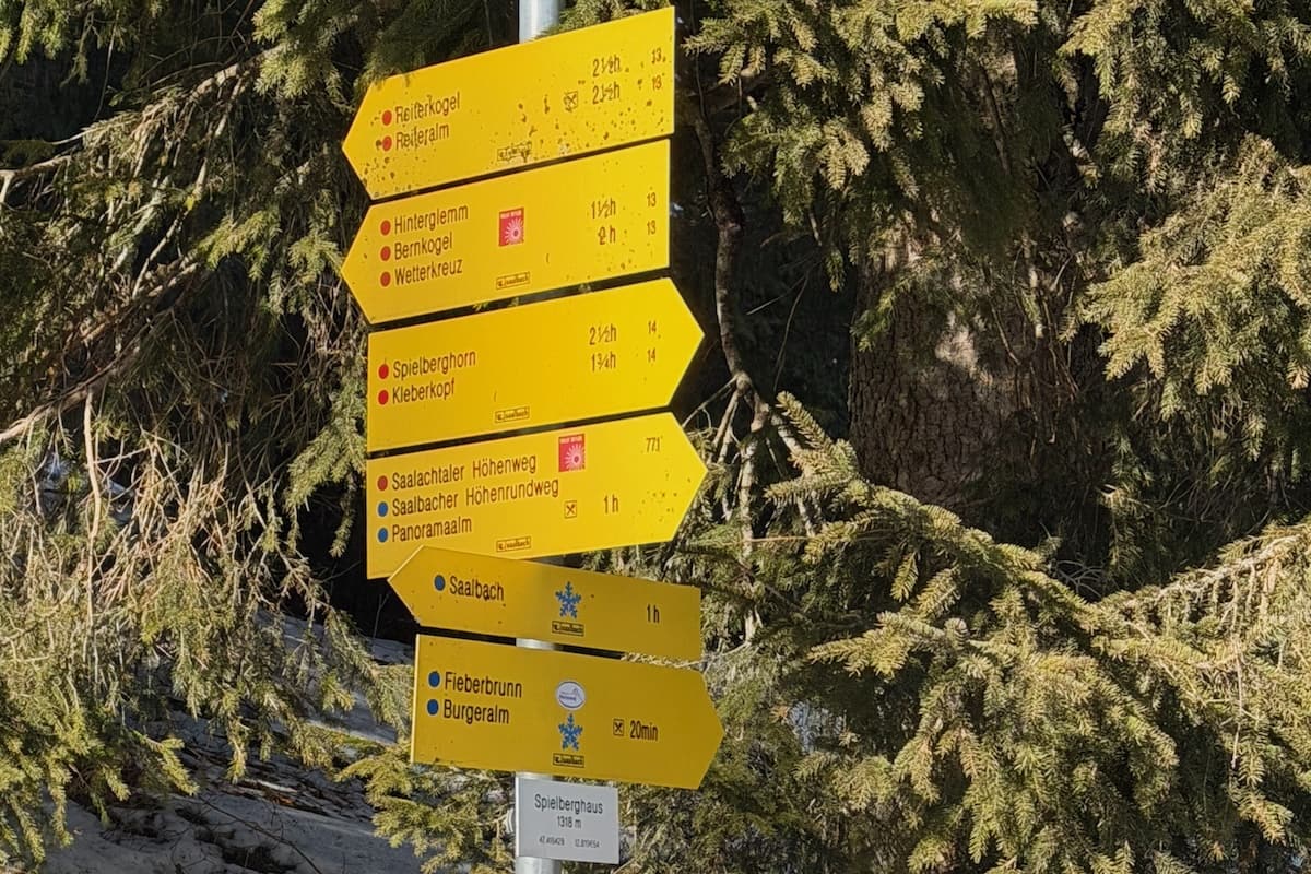 Yellow signs of hiking trails in Saalbach-Hinterglemm, Austria