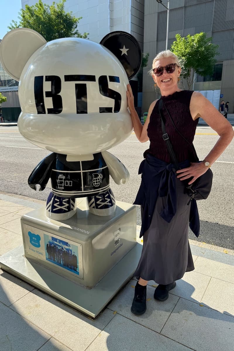 Woman next to BTS Gangnamdol on K-Star Road Seoul Korea