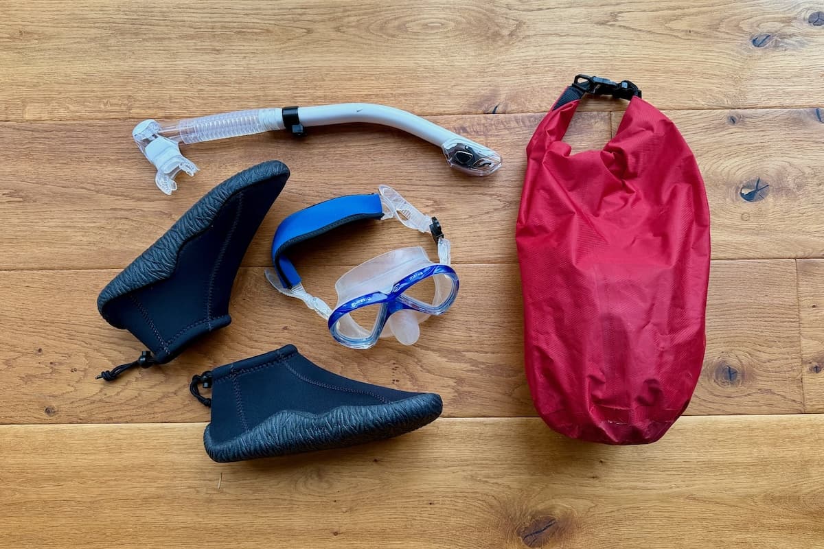 Snorkel, mask, boots and dry bag for scuba diving and snorkelling