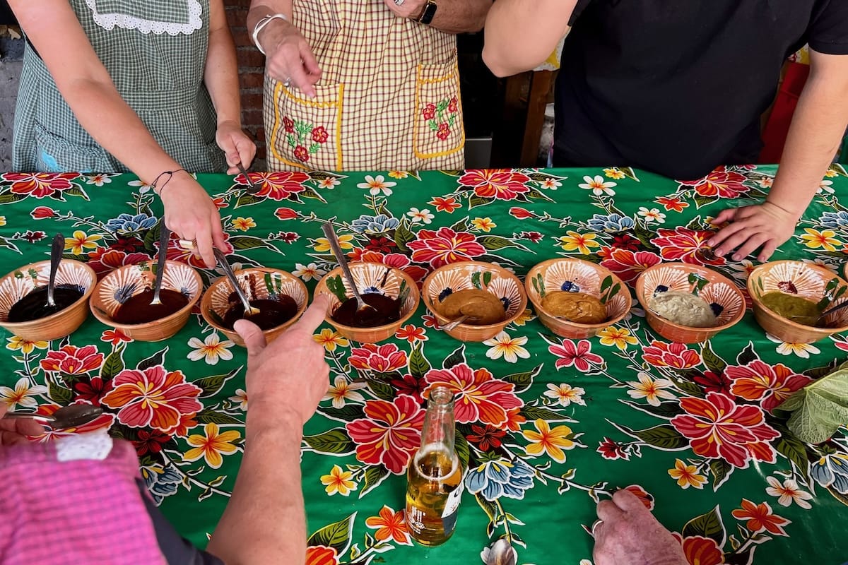Tasting moles in cooking class in Oaxaca, Mexico