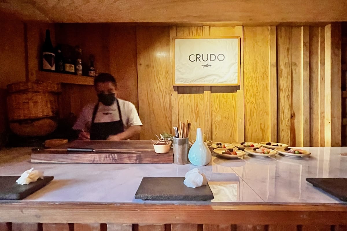 Chef preparing food at Crudo in Oaxaca, Mexico