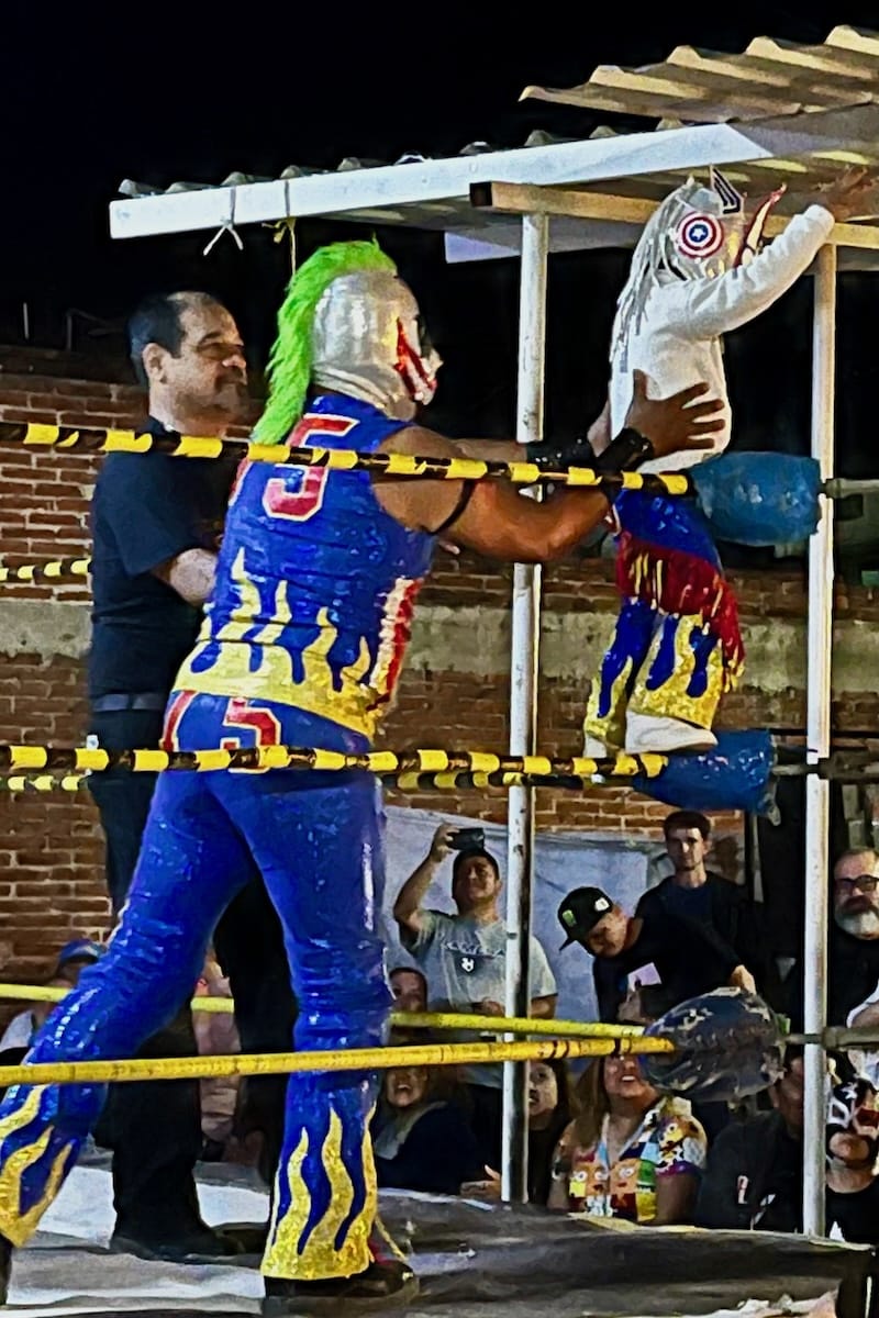 Child and Luchador inn costume at Lucha Libre in Oaxaca, Mexico