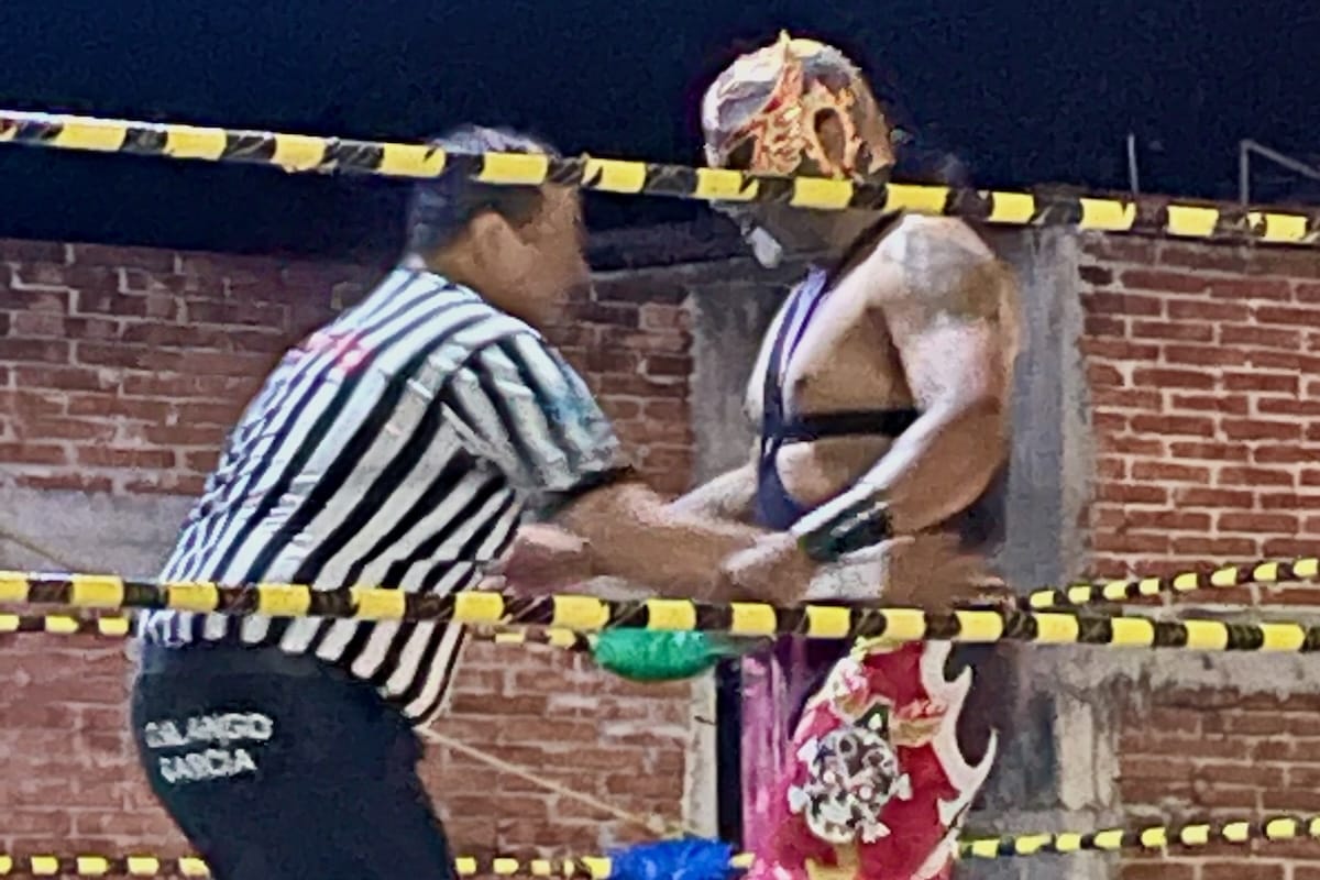 Referee with Luchador in Lucha Libre in Oaxaca, Mexico